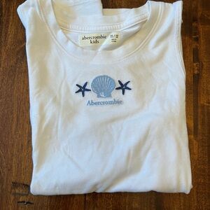 Abercrombie Girls White Tee with Blue Beach themed Embroidery